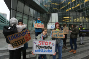 A group of Ukrainian people protesting against Putin's disinformation outside Meta HQ