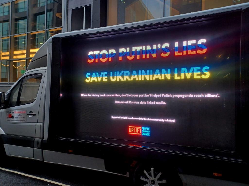 A mobile billboard outside Meta HQ in Dublin with message, 'Stop Putin's lies, save Ukrainian lives.'